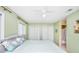 King-size bed in a green bedroom with ensuite bathroom at 775 Plantation Dr. # 88, Little River, SC 29566