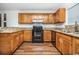 Kitchen with granite countertops and wood cabinets at 775 Plantation Dr. # 88, Little River, SC 29566