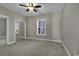 Bright bedroom featuring a ceiling fan and mirrored closet doors at 4874 Luster Leaf Circle # 304, Myrtle Beach, SC 29577