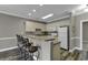 Kitchen features a breakfast bar and white cabinets at 4874 Luster Leaf Circle # 304, Myrtle Beach, SC 29577