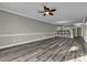 Spacious living room featuring hardwood floors and access to a balcony at 4874 Luster Leaf Circle # 304, Myrtle Beach, SC 29577