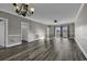 Large living room with hardwood floors and patio access at 4874 Luster Leaf Circle # 304, Myrtle Beach, SC 29577