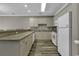Simple kitchen with white appliances and wood-look flooring at 4874 Luster Leaf Circle # 304, Myrtle Beach, SC 29577