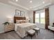 Main bedroom with king-size bed, stylish decor, and plenty of natural light at 4133 Bayhill St., Myrtle Beach, SC 29579