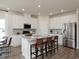 Modern kitchen with white cabinets, island, and stainless steel appliances at 4133 Bayhill St., Myrtle Beach, SC 29579