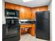 Compact kitchen with microwave, stove, and refrigerator at 1501 S Ocean Blvd. # 646, Myrtle Beach, SC 29577