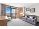 Living room with ocean view balcony, sofa, and ample natural light at 1501 S Ocean Blvd. # 646, Myrtle Beach, SC 29577