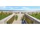 Wooden steps lead to a sandy beach with ocean views at 1501 S Ocean Blvd. # 646, Myrtle Beach, SC 29577