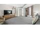King-size bed, TV, and closet in this well-lit bedroom at 1501 S Ocean Blvd. # 646, Myrtle Beach, SC 29577