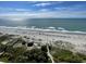 Aerial view of beach with ocean and umbrellas at 5308 N Ocean Blvd. # 1804, Myrtle Beach, SC 29577