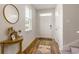 Bright and airy entryway with hardwood floors, and a small console table at 538 Goldstar St., Conway, SC 29526