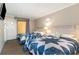 Bedroom with two twin beds and an adjoining balcony at 6900 N Ocean Blvd. # 910, Myrtle Beach, SC 29572