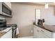 Kitchenette with granite countertop and stainless steel appliances at 6900 N Ocean Blvd. # 910, Myrtle Beach, SC 29572