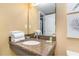 Bathroom vanity with granite countertop and mirror at 6900 N Ocean Blvd. # 910, Myrtle Beach, SC 29572