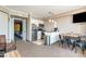 Open kitchen with stainless steel appliances and breakfast bar at 6900 N Ocean Blvd. # 910, Myrtle Beach, SC 29572