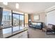 Living room with balcony access and ocean view at 6900 N Ocean Blvd. # 910, Myrtle Beach, SC 29572