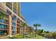 Exterior of building with grassy courtyard and picnic tables at 6900 N Ocean Blvd. # 910, Myrtle Beach, SC 29572