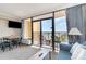 Living room with ocean view and balcony access at 6900 N Ocean Blvd. # 910, Myrtle Beach, SC 29572