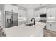 Modern kitchen with white cabinets, a large island, and stainless steel appliances at 16 Mullet Bay Rd, Pawleys Island, SC 29585