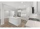 Modern kitchen with white cabinets, quartz countertops, and stainless steel appliances at 16 Mullet Bay Rd, Pawleys Island, SC 29585