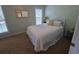 Well-lit bedroom with a double bed and window at 5226 Highway 17 Business, Murrells Inlet, SC 29576