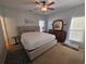 Bright bedroom with a king-size bed, dresser, and large windows at 5226 Highway 17 Business, Murrells Inlet, SC 29576