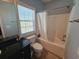 Clean bathroom with tub shower, toilet and granite vanity at 5226 Highway 17 Business, Murrells Inlet, SC 29576