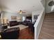 Open living room and dining area with leather furniture and hardwood floors at 5226 Highway 17 Business, Murrells Inlet, SC 29576