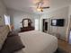 Main bedroom with king bed, dresser, large closet, and mounted TV at 5226 Highway 17 Business, Murrells Inlet, SC 29576