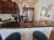 Kitchen with breakfast bar, stainless steel appliances, and view into the bedroom at 5226 Highway 17 Business, Murrells Inlet, SC 29576