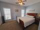 Bedroom with double bed, ceiling fan and two windows at 5226 Highway 17 Business, Murrells Inlet, SC 29576