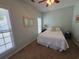 Cozy bedroom with double bed, window, and mirror at 5226 Highway 17 Business, Murrells Inlet, SC 29576