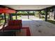 Covered patio with seating and a kayak at 5226 Highway 17 Business, Murrells Inlet, SC 29576