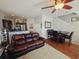 Open living room and kitchen with a comfy leather couch and breakfast bar at 5226 Highway 17 Business, Murrells Inlet, SC 29576