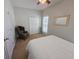 Bright bedroom featuring a queen bed and seating area at 5226 Highway 17 Business, Murrells Inlet, SC 29576