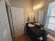Bathroom with granite double vanity and mirror at 5226 Highway 17 Business, Murrells Inlet, SC 29576