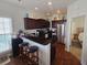 Modern kitchen with dark wood cabinets, stainless steel appliances, and granite countertops at 5226 Highway 17 Business, Murrells Inlet, SC 29576