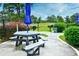 Community picnic area with tables, grills, and umbrellas at 4789 Wild Iris Dr. # 203, Myrtle Beach, SC 29577