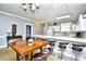 Kitchen with breakfast bar and adjoining dining area with a table for six at 4789 Wild Iris Dr. # 203, Myrtle Beach, SC 29577