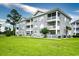 Three-story building with stone exterior and balconies at 4789 Wild Iris Dr. # 203, Myrtle Beach, SC 29577