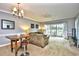 Spacious living room with access to balcony and golf course views at 4789 Wild Iris Dr. # 203, Myrtle Beach, SC 29577