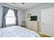 Bedroom with a dresser and TV, great for guests at 4789 Wild Iris Dr. # 203, Myrtle Beach, SC 29577