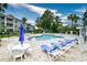 Inviting community pool with lounge chairs and patio tables at 4789 Wild Iris Dr. # 203, Myrtle Beach, SC 29577