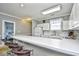 Well-equipped kitchen with white cabinets and breakfast bar seating at 4789 Wild Iris Dr. # 203, Myrtle Beach, SC 29577