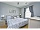 Spacious bedroom with a king-size bed and large window at 4789 Wild Iris Dr. # 203, Myrtle Beach, SC 29577