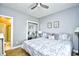 King-size bed in a well-lit bedroom with en-suite bathroom at 4789 Wild Iris Dr. # 203, Myrtle Beach, SC 29577