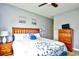 Bright bedroom with king-size bed, wood furniture, and large windows at 4789 Wild Iris Dr. # 203, Myrtle Beach, SC 29577
