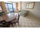 Simple condo dining area with a round table and four chairs at 1501 S Ocean Blvd. # 1540, Myrtle Beach, SC 29577