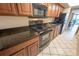 Kitchen with granite countertops and black appliances at 1501 S Ocean Blvd. # 1540, Myrtle Beach, SC 29577
