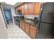 Kitchen with granite countertops, black appliances, and wood cabinets at 1501 S Ocean Blvd. # 1540, Myrtle Beach, SC 29577